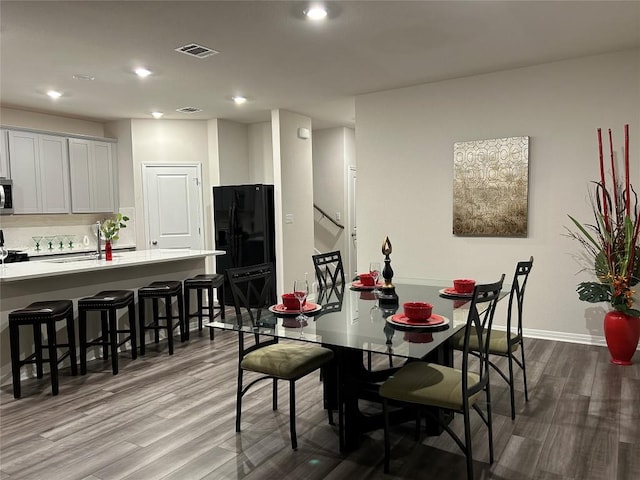 11503 Copperstone Ave Unit 89, Austin, TX 78748 - dining space featuring wood finished floors and recessed lighting