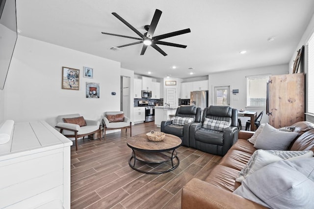 170 Banff Dr, Kyle, TX 78640 - living area with a ceiling fan, dark wood finished floors, and recessed lighting