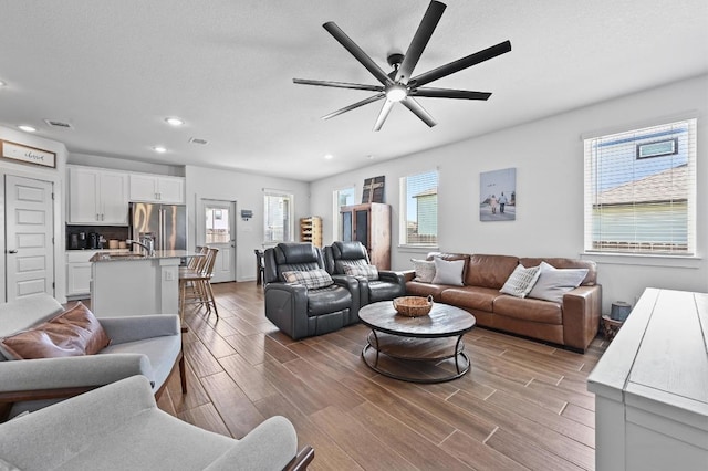 170 Banff Dr, Kyle, TX 78640 - living room featuring wood finish floors, recessed lighting, and a ceiling fan