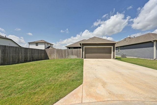 170 Banff Dr, Kyle, TX 78640 - view of yard featuring concrete driveway and an attached garage