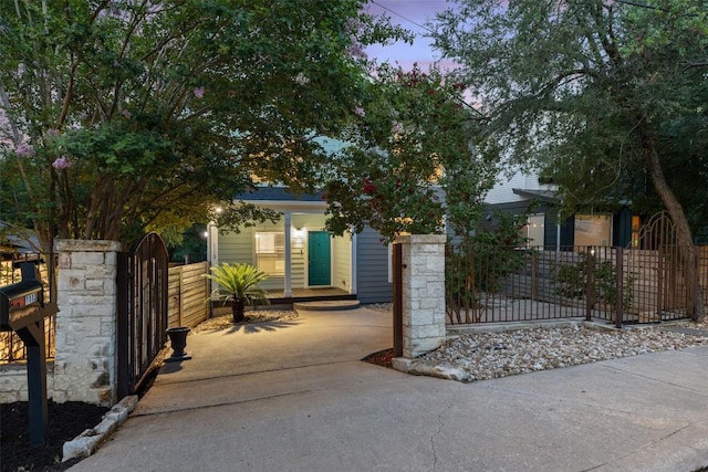 1113 Lott Ave, Austin, TX 78721 - view of property hidden behind natural elements featuring a fenced front yard and a gate