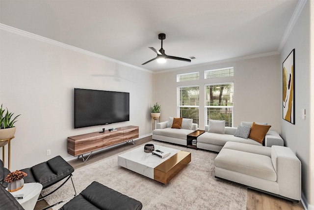 1113 Lott Ave, Austin, TX 78721 - living room with ornamental molding, a ceiling fan, and wood finished floors
