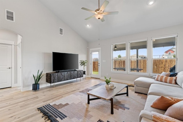 3101 Maysilee St, Austin, TX 78728 - living area with high vaulted ceiling, light wood-type flooring, a ceiling fan, arched walkways, and recessed lighting