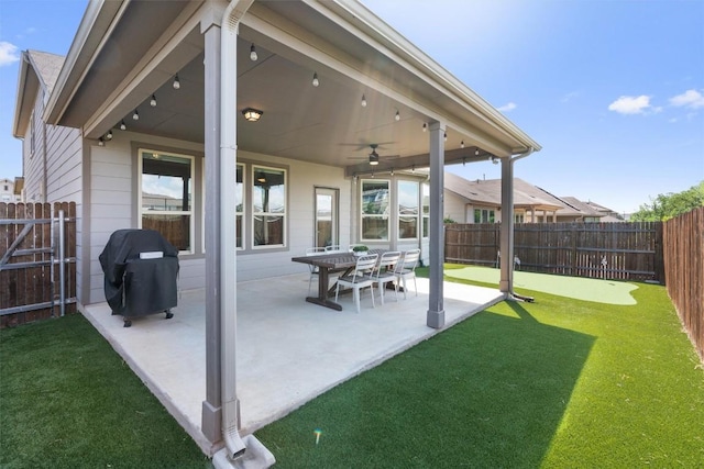 3101 Maysilee St, Austin, TX 78728 - fenced backyard featuring area for grilling, a patio, and a ceiling fan