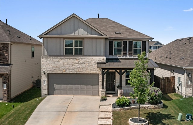 3101 Maysilee St, Austin, TX 78728 - craftsman inspired home with board and batten siding, stone siding, driveway, a front lawn, and an attached garage
