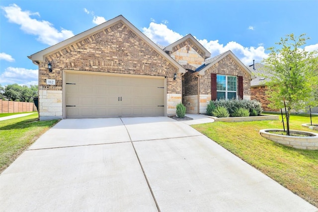 112 Silver Ridge Dr, Georgetown, TX 78633 - view of front of property with an attached garage, stone siding, concrete driveway, and brick siding