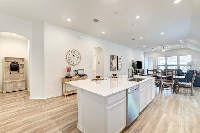 112 Silver Ridge Dr, Georgetown, TX 78633 - kitchen featuring arched walkways, stainless steel dishwasher, light wood-type flooring, recessed lighting, and a ceiling fan