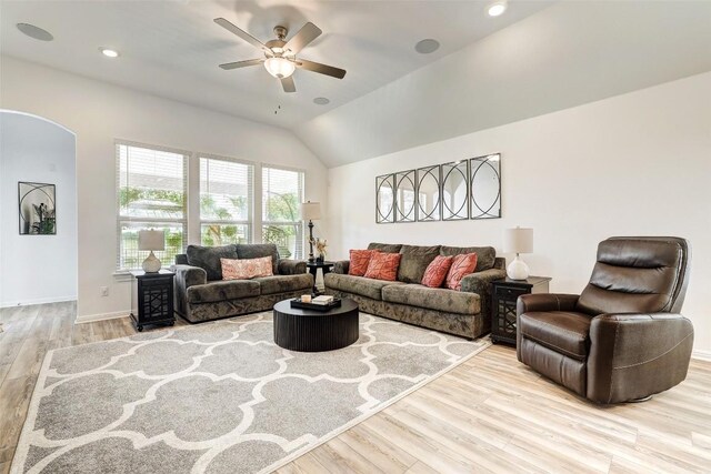 112 Silver Ridge Dr, Georgetown, TX 78633 - living room featuring wood finished floors, ceiling fan, vaulted ceiling, arched walkways, and recessed lighting