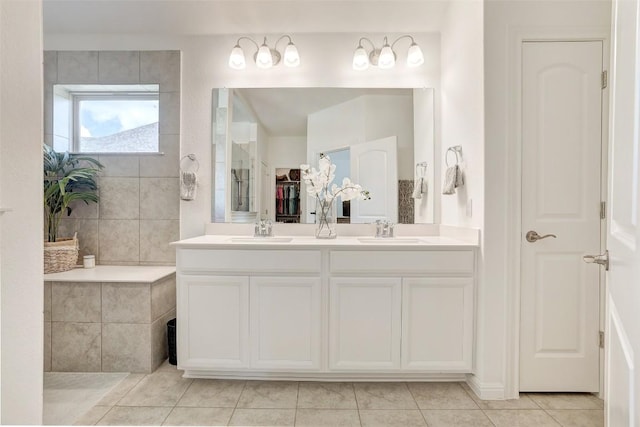 112 Silver Ridge Dr, Georgetown, TX 78633 - bathroom featuring double vanity, tile patterned floors, and a walk in closet
