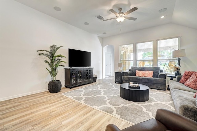 112 Silver Ridge Dr, Georgetown, TX 78633 - living room with arched walkways, wood finished floors, a ceiling fan, vaulted ceiling, and recessed lighting