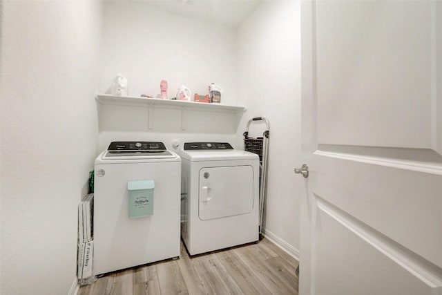 112 Silver Ridge Dr, Georgetown, TX 78633 - washroom featuring washing machine and clothes dryer and light wood-type flooring