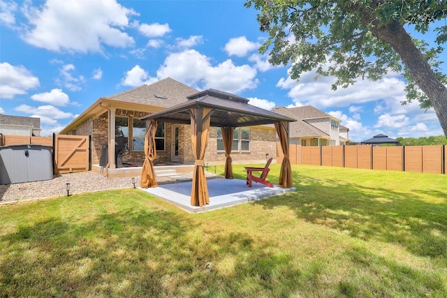 112 Silver Ridge Dr, Georgetown, TX 78633 - rear view of house with a gazebo, brick siding, and a fenced backyard