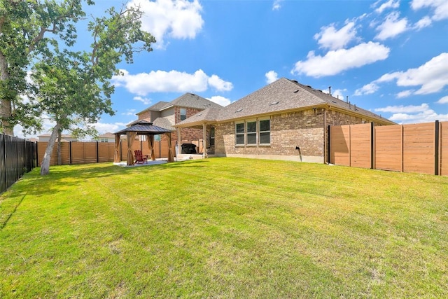 112 Silver Ridge Dr, Georgetown, TX 78633 - rear view of house with a gazebo, a patio area, a fenced backyard, and brick siding