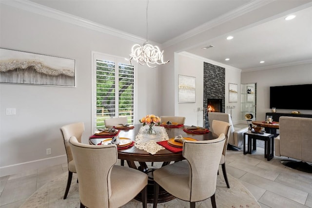22126 Briarcliff Dr, Spicewood, TX 78669 - dining space with a chandelier, crown molding, recessed lighting, and a fireplace