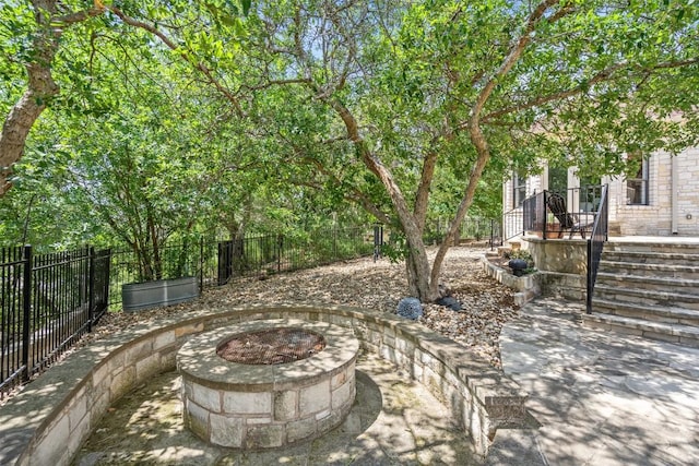 22126 Briarcliff Dr, Spicewood, TX 78669 - fenced backyard featuring a fire pit and a patio area