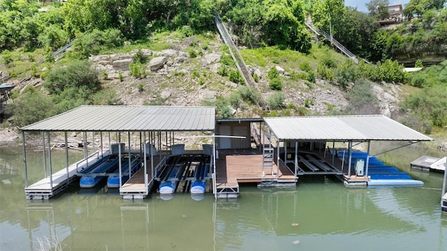 22126 Briarcliff Dr, Spicewood, TX 78669 - dock area featuring boat lift and a water view