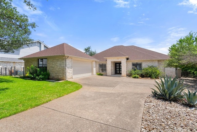 22126 Briarcliff Dr, Spicewood, TX 78669 - view of front of house featuring concrete driveway, a garage, a shingled roof, and stone siding