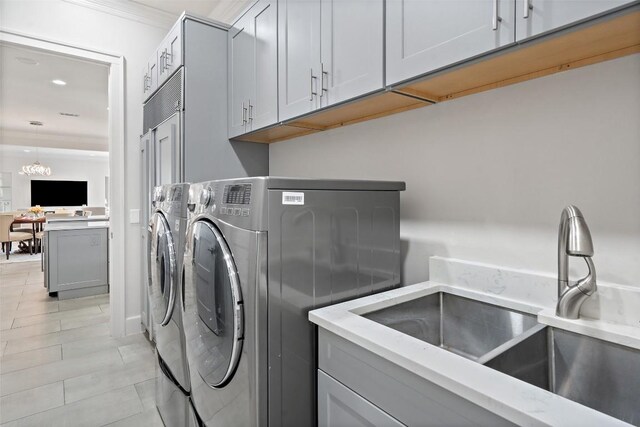 22126 Briarcliff Dr, Spicewood, TX 78669 - laundry room featuring cabinet space, washing machine and clothes dryer, recessed lighting, and light tile patterned floors