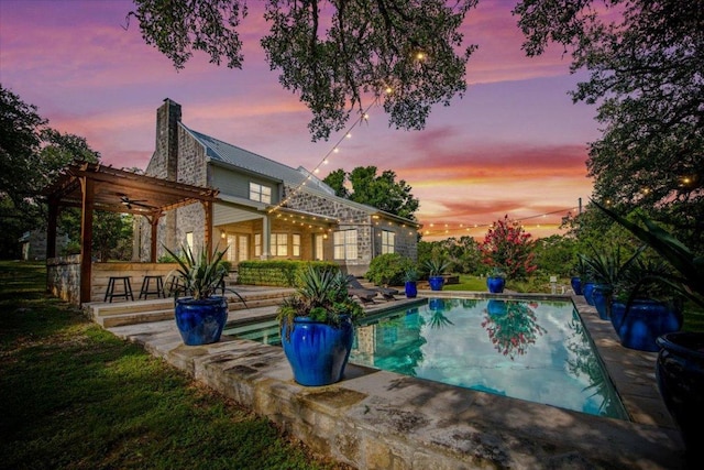 1660 W Mccarty Ln, San Marcos, TX 78666 - pool at dusk with a patio area and an outdoor pool
