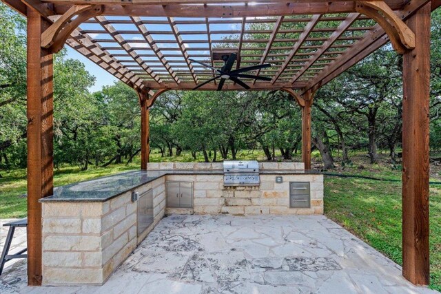 1660 W Mccarty Ln, San Marcos, TX 78666 - view of patio / terrace featuring a pergola, area for grilling, view of scattered trees, and a ceiling fan