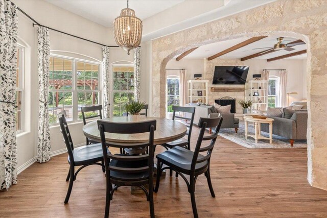 1660 W Mccarty Ln, San Marcos, TX 78666 - dining space with arched walkways, healthy amount of natural light, beam ceiling, and a ceiling fan