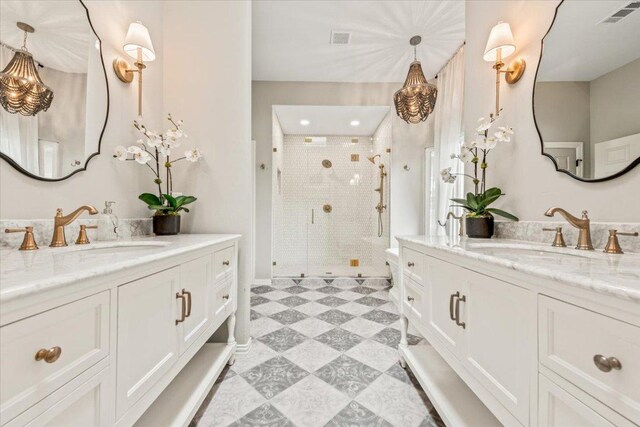 1660 W Mccarty Ln, San Marcos, TX 78666 - full bath featuring tile patterned floors, a stall shower, and two vanities