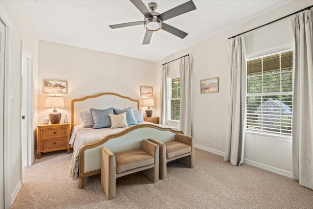 1660 W Mccarty Ln, San Marcos, TX 78666 - bedroom featuring light carpet and ceiling fan