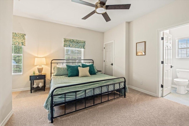 1660 W Mccarty Ln, San Marcos, TX 78666 - carpeted bedroom with ensuite bath and a ceiling fan