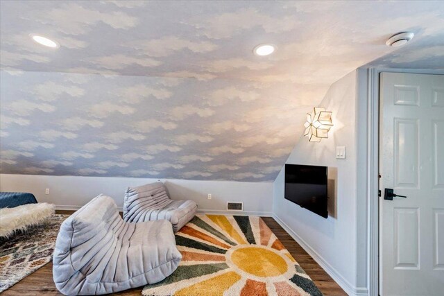 1660 W Mccarty Ln, San Marcos, TX 78666 - sitting room with wood finished floors, recessed lighting, and lofted ceiling