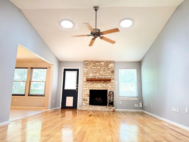 4202 Kilgore Ln, Austin, TX 78727 - unfurnished living room featuring a ceiling fan, wood finished floors, a fireplace, and vaulted ceiling