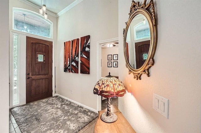 5501 Hitching Post, Lago Vista, TX 78645 - tiled foyer entrance with crown molding, a high ceiling, and carpet flooring