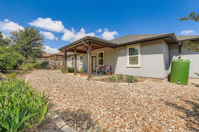 5501 Hitching Post, Lago Vista, TX 78645 - view of front of property featuring stucco siding and a patio area