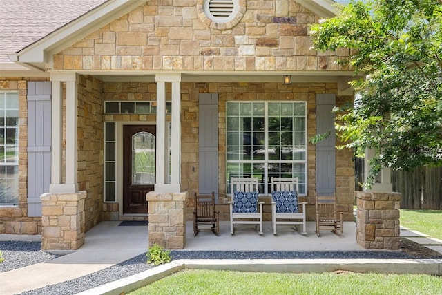 300 Errol Dr, Spicewood, TX 78669 - property entrance featuring a porch and stone siding
