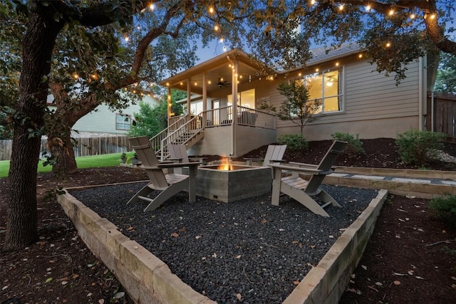 300 Errol Dr, Spicewood, TX 78669 - view of front of house with a fire pit, ceiling fan, and stairway
