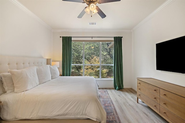 300 Errol Dr, Spicewood, TX 78669 - bedroom featuring ornamental molding, light wood-type flooring, and ceiling fan