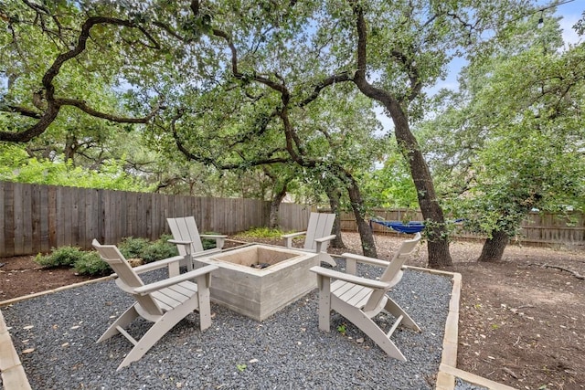 300 Errol Dr, Spicewood, TX 78669 - fenced backyard featuring an outdoor fire pit