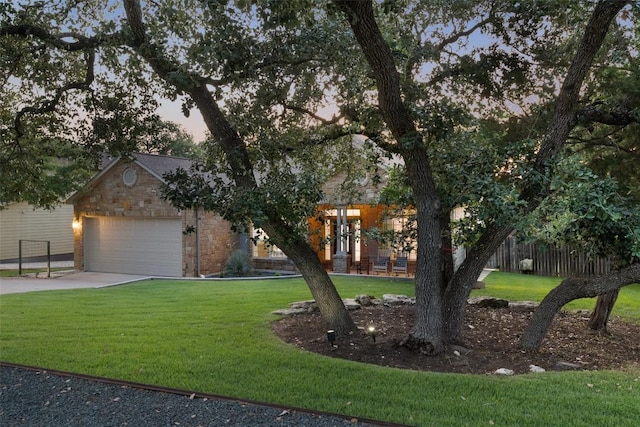 300 Errol Dr, Spicewood, TX 78669 - obstructed view of property with driveway, brick siding, and a garage