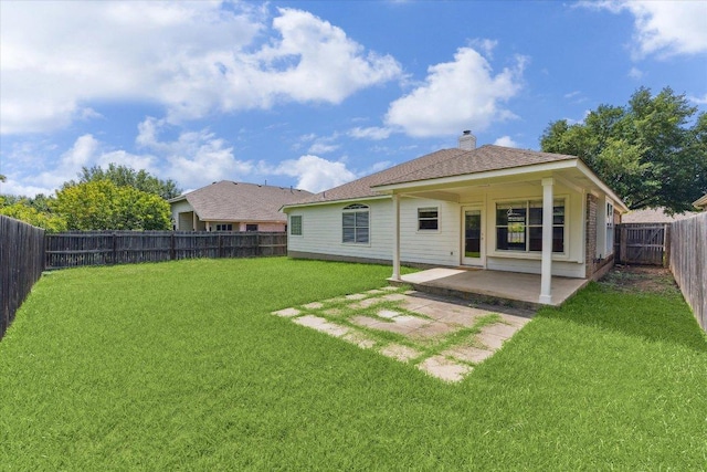 3659 Nolan Ryan Blvd, Round Rock, TX 78665 - back of house featuring a patio area, a fenced backyard, and a chimney