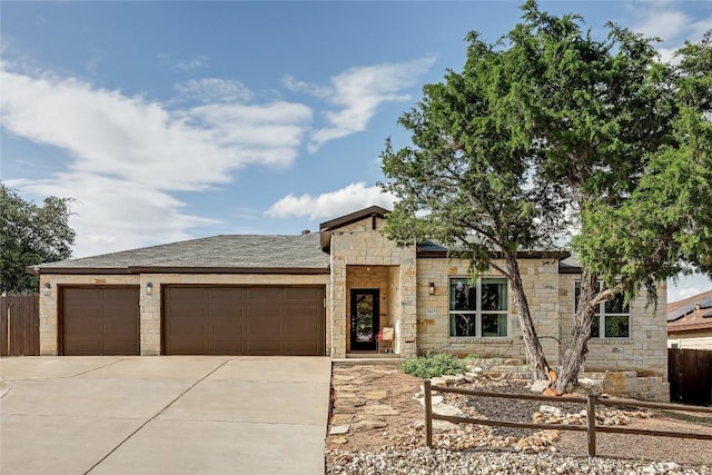 3605 Bunyan Cir, Lago Vista, TX 78645 - view of front of property featuring stone siding, a garage, and driveway