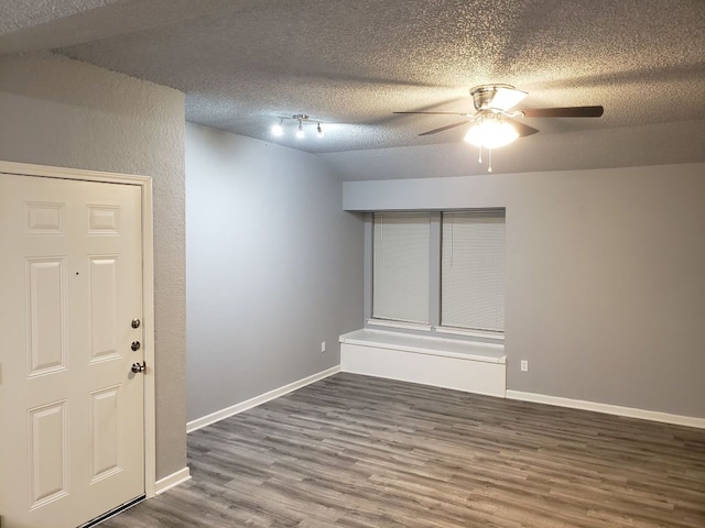 1221 W Hopkins St Unit 11, San Marcos, TX 78666 - spare room featuring a ceiling fan, wood finished floors, and a textured ceiling