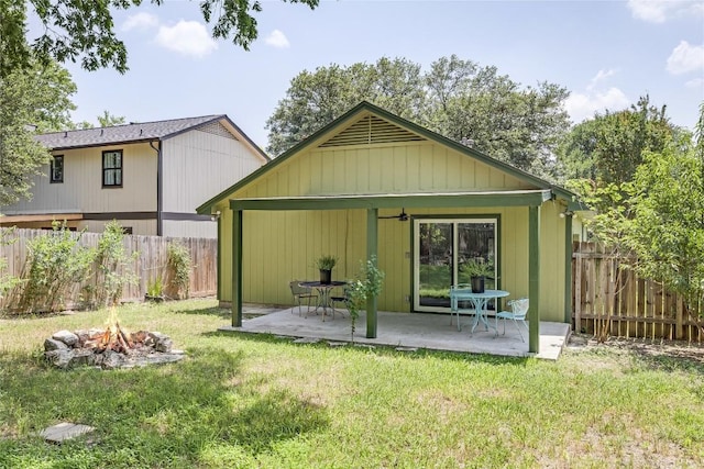 1406 Byers Ln, Austin, TX 78753 - back of house with a fire pit, a patio, and a fenced backyard