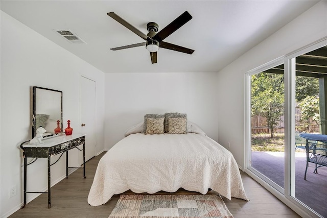 1406 Byers Ln, Austin, TX 78753 - bedroom featuring wood finished floors, access to exterior, and ceiling fan