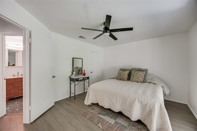 1406 Byers Ln, Austin, TX 78753 - bedroom with wood finished floors and ceiling fan