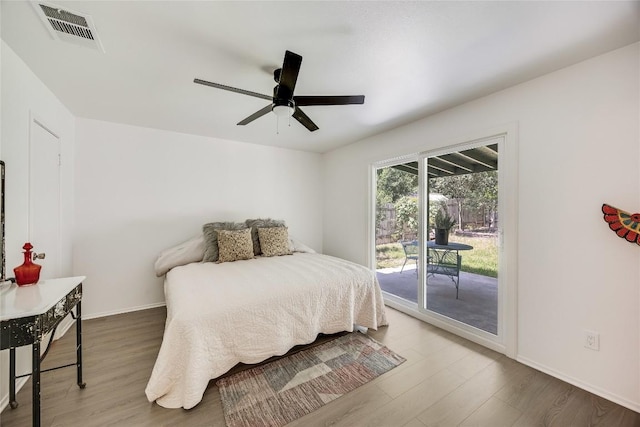 1406 Byers Ln, Austin, TX 78753 - bedroom with access to outside, wood finished floors, and a ceiling fan