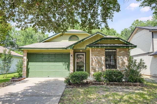 1406 Byers Ln, Austin, TX 78753 - view of front of home with concrete driveway, a garage, and brick siding