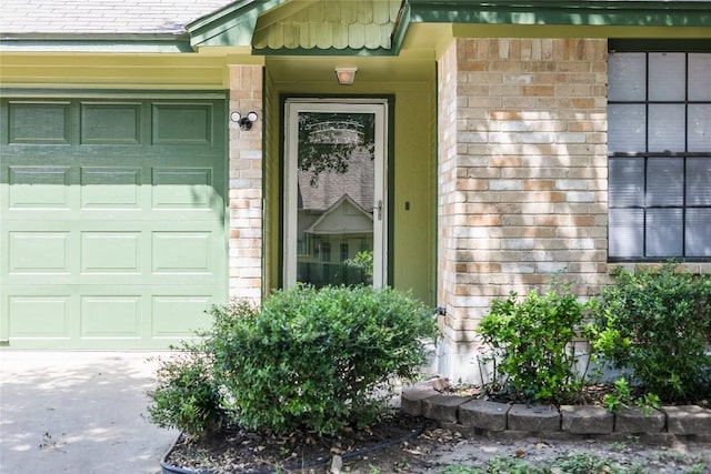 1406 Byers Ln, Austin, TX 78753 - property entrance featuring an attached garage and brick siding