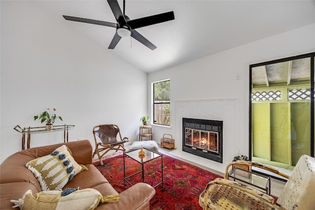 1406 Byers Ln, Austin, TX 78753 - living area with vaulted ceiling, a ceiling fan, and a glass covered fireplace