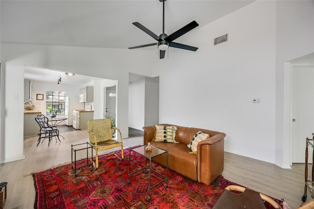 1406 Byers Ln, Austin, TX 78753 - living area with a ceiling fan, light wood-type flooring, and high vaulted ceiling
