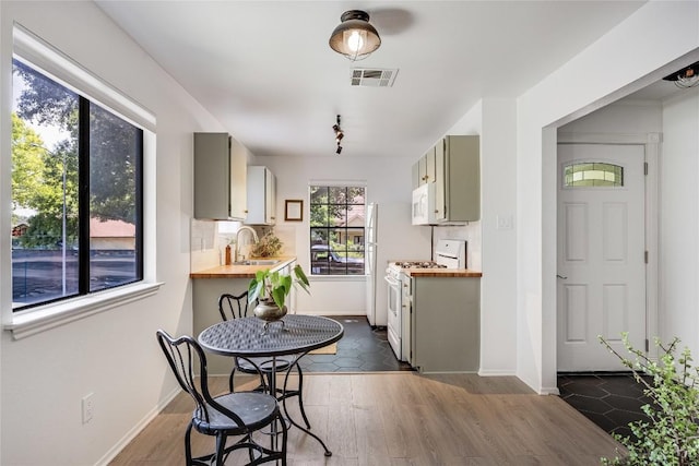 1406 Byers Ln, Austin, TX 78753 - dining area featuring dark wood-style floors and baseboards