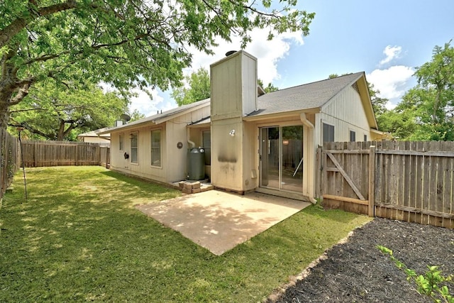 4614 Ganymede Dr, Austin, TX 78727 - back of property with a chimney, a fenced backyard, a patio, and a gate